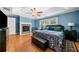 Spacious main bedroom features a ceiling fan, sitting area and fireplace at 4715 Northridge Dr, Cumming, GA 30040