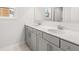 Bathroom with double vanity, framed mirrors, and natural light at 7169 Linden Dr, South Fulton, GA 30349