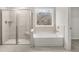 Contemporary bathroom featuring a shower and soaking tub at 7169 Linden Dr, South Fulton, GA 30349