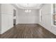 Elegant dining room with hardwood floors, wainscoting, tray ceiling, and large windows for natural light at 7169 Linden Dr, South Fulton, GA 30349