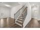 Open concept foyer features hardwood floors, stairwell and a clear view of the front door at 7169 Linden Dr, South Fulton, GA 30349
