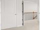 Spacious hallway with two white paneled doors and neutral walls at 7169 Linden Dr, South Fulton, GA 30349