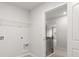 Laundry room with wire rack shelving and neutral paint at 7169 Linden Dr, South Fulton, GA 30349