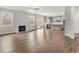 Open-concept living room flows into modern kitchen with hardwood floors and plenty of natural light at 7169 Linden Dr, South Fulton, GA 30349