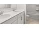 Bathroom features a double sink vanity with quartz countertops and modern fixtures at 7171 Linden Dr, South Fulton, GA 30349