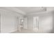 Bright bedroom featuring neutral walls, carpet, and a glimpse into another room at 7171 Linden Dr, South Fulton, GA 30349