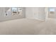 Large carpeted bedroom with multiple windows, closet, and door to hall at 7171 Linden Dr, South Fulton, GA 30349