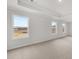 Carpeted bonus room with multiple windows providing natural light at 7171 Linden Dr, South Fulton, GA 30349