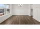 Bright dining room boasts beautiful hardwood floors and large windows providing an abundance of natural light at 7171 Linden Dr, South Fulton, GA 30349