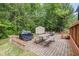 Backyard featuring a paved patio area with picnic table and barbeque grill at 3210 Avondale Pkwy, Powder Springs, GA 30127