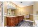 Bathroom featuring double vanity, large mirror, and modern fixtures at 3210 Avondale Pkwy, Powder Springs, GA 30127