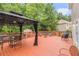 Outdoor deck with dining table and a shaded gazebo, perfect for entertaining at 3210 Avondale Pkwy, Powder Springs, GA 30127