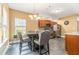 Sunlit eat-in kitchen with stainless steel appliances and granite counters at 3210 Avondale Pkwy, Powder Springs, GA 30127