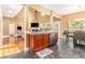 Modern kitchen with granite countertops, stainless steel appliances, and adjacent breakfast nook at 3210 Avondale Pkwy, Powder Springs, GA 30127