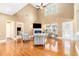 Bright and open living room with hardwood floors, vaulted ceilings, and a cozy seating area at 3210 Avondale Pkwy, Powder Springs, GA 30127