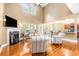 Spacious living room showcasing hardwood floors, a fireplace, and an open concept design at 3210 Avondale Pkwy, Powder Springs, GA 30127