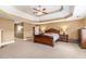 Large main bedroom with tray ceiling, fireplace, and ensuite bathroom at 3210 Avondale Pkwy, Powder Springs, GA 30127