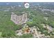 Aerial view of home in a wooded neighborhood near Lake Lanier at 3320 Goldmist Dr, Buford, GA 30519