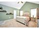 Comfortable bedroom with vaulted ceilings, soft green walls, and a cozy bed with a neutral color scheme at 3320 Goldmist Dr, Buford, GA 30519
