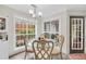 Dining room with decorative chairs, a glass table and a door leading to the outside at 3320 Goldmist Dr, Buford, GA 30519