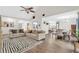 Open concept living and dining area with neutral tones and hardwood flooring at 3320 Goldmist Dr, Buford, GA 30519