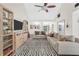 Bright living room with vaulted ceilings and open layout to the entry at 3320 Goldmist Dr, Buford, GA 30519