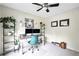 Bright office space with desk, shelving, and natural light. Decorator's touch included at 3320 Goldmist Dr, Buford, GA 30519