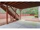 Spacious backyard features a patio, stairs to a deck, and a wood fence for privacy at 3920 Baverton Dr, Suwanee, GA 30024