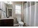 Bathroom with shower, vanity, and a neutral color palette at 3920 Baverton Dr, Suwanee, GA 30024