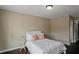 Neutral bedroom with natural light and hardwood floors at 3920 Baverton Dr, Suwanee, GA 30024