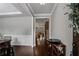 Inviting entryway with hardwood floors, neutral paint, and views into the main living area at 3920 Baverton Dr, Suwanee, GA 30024