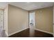 Hallway with access to rooms, hardwood floors, and natural light at 3920 Baverton Dr, Suwanee, GA 30024