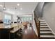 Open-concept kitchen with granite countertops and views into the living room and staircase at 3920 Baverton Dr, Suwanee, GA 30024