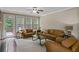 Bright living room with hardwood floors, fireplace, and access to the deck through glass doors at 3920 Baverton Dr, Suwanee, GA 30024