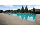 Community pool featuring clear blue water, lounge chairs, and well-maintained surroundings at 3920 Baverton Dr, Suwanee, GA 30024