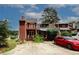 Backyard featuring a two-story deck and stairs, as well as a parking area at 5461 Park S Pl, Atlanta, GA 30349