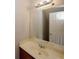 Bathroom featuring a vanity with sink, large mirror, and a neutral color palette at 5461 Park S Pl, Atlanta, GA 30349