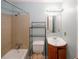Bathroom featuring tile surround, shower and tub combo, and a vanity sink at 5461 Park S Pl, Atlanta, GA 30349