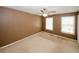 Bedroom featuring a ceiling fan and two windows for natural light at 5461 Park S Pl, Atlanta, GA 30349