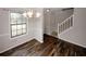 Dining room with wood floors, chandelier, and large window providing ample natural light at 5461 Park S Pl, Atlanta, GA 30349