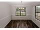 Bright dining room showcasing wood floors and large windows that bring the outdoors in at 5461 Park S Pl, Atlanta, GA 30349