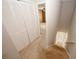 Hallway leading to carpeted staircase, closet and adjacent bedroom at 5461 Park S Pl, Atlanta, GA 30349
