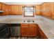 Kitchen with granite countertops, stainless steel appliances, and wood cabinets at 5461 Park S Pl, Atlanta, GA 30349