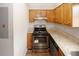 Kitchen featuring stainless steel appliances, wood cabinets, and granite countertops at 5461 Park S Pl, Atlanta, GA 30349