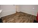 Living room featuring hard wood floors, neutral colored walls, and ample space at 5461 Park S Pl, Atlanta, GA 30349