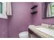 Bathroom with purple walls, modern sink, and granite countertop at 2087 Chestnut Way, Lithia Springs, GA 30122