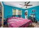 Bright bedroom with a ceiling fan and wood-look flooring at 2087 Chestnut Way, Lithia Springs, GA 30122