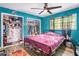 Bright bedroom features a ceiling fan, two closets, and wood-look flooring at 2087 Chestnut Way, Lithia Springs, GA 30122