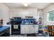 Kitchen featuring black appliances and blue countertops, with white cabinets at 2087 Chestnut Way, Lithia Springs, GA 30122