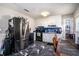 Kitchen with black and white marbled flooring, white cabinets, and black appliances at 2087 Chestnut Way, Lithia Springs, GA 30122